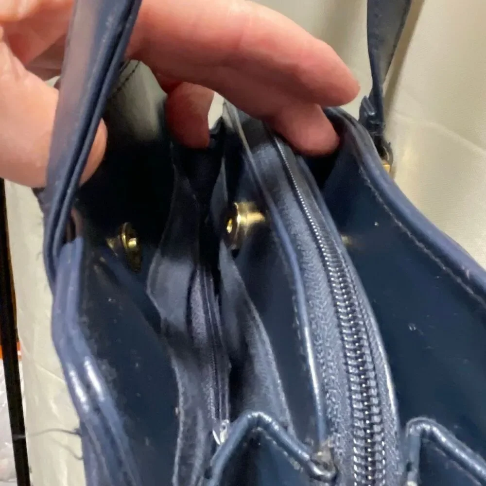 Vintage Colette blue leather shoulder bag.